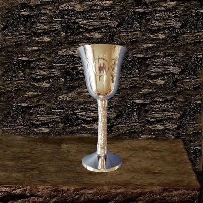 Brass chalice decorated with the symbol of the Mother Goddess: a triple moon